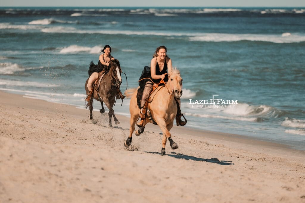 cowgirls galloping up the beach in flying dresses