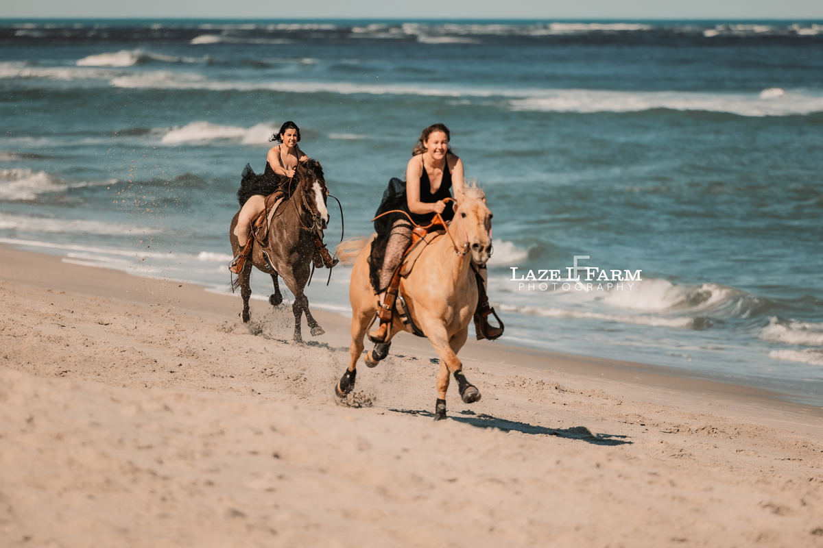 cowgirls galloping up the beach in flying dresses