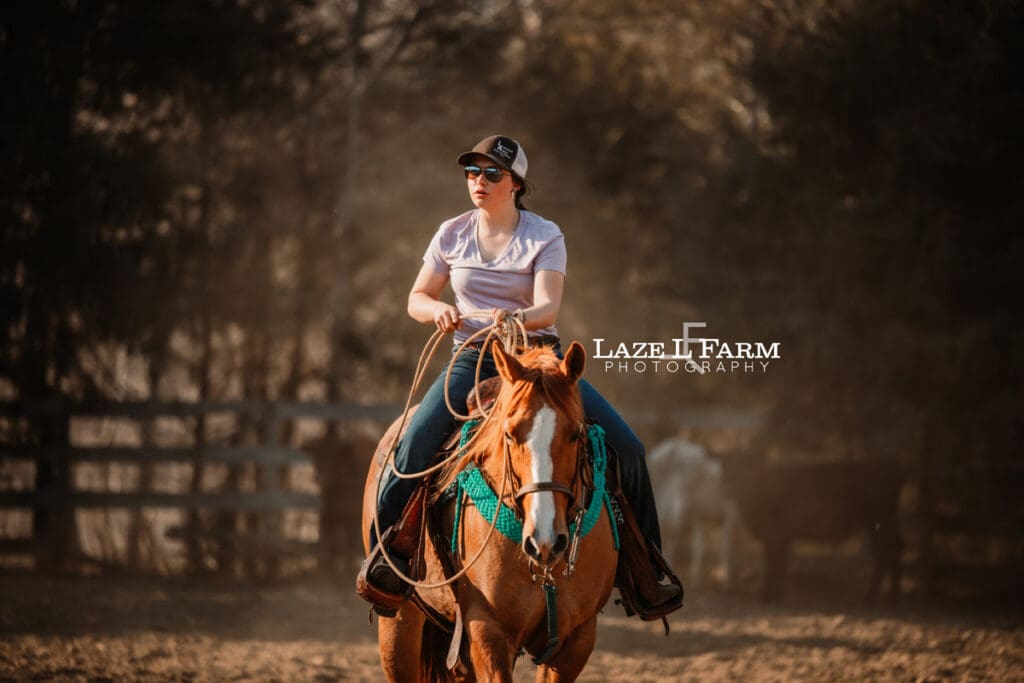 cowgirl riding her horse