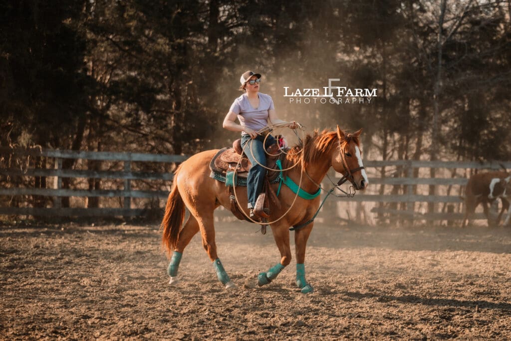 cowgirl riding her horse