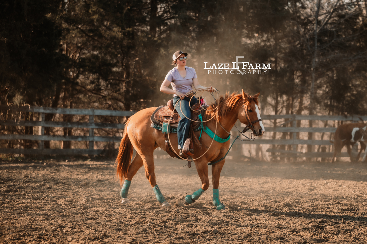 cowgirl riding her horse