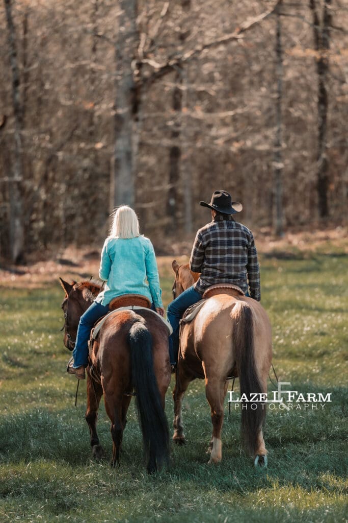 couple riding horses away
