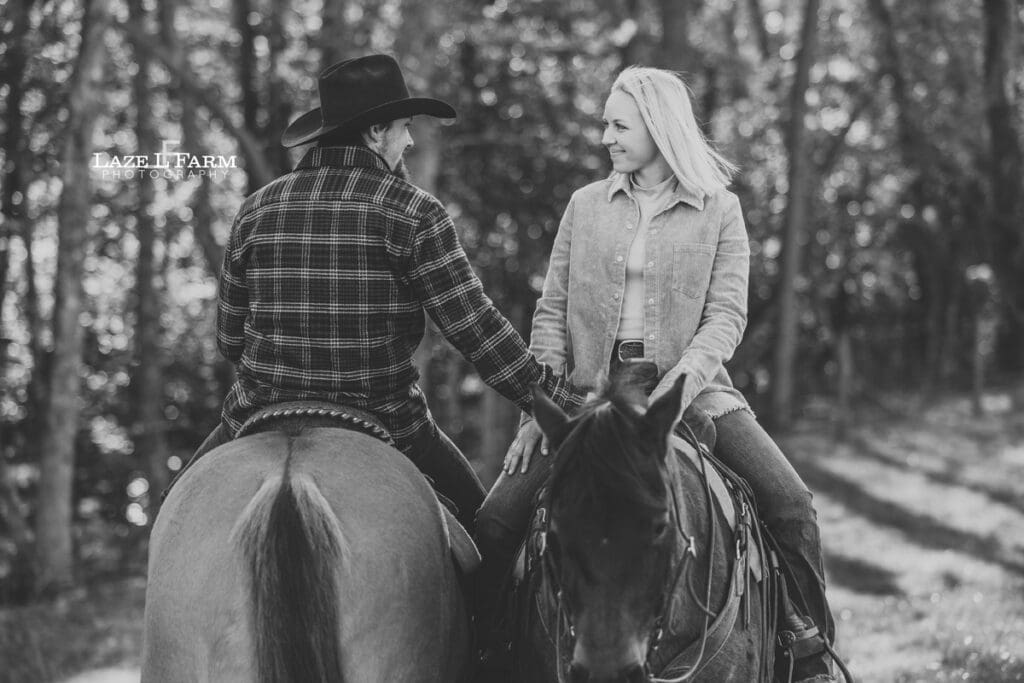 couple riding horses looking at each other