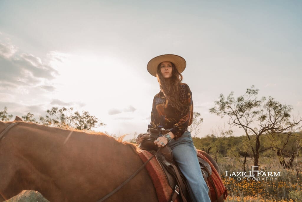 cowgirl sitting on her horse