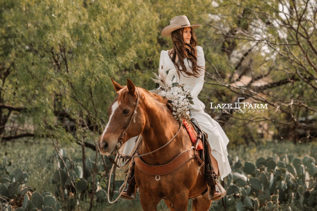 cowgirl bride sitting on her horse
