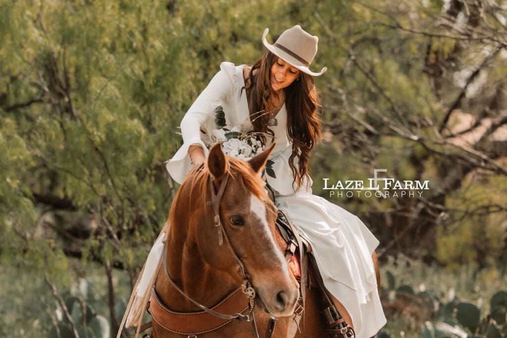 cowgirl bride sitting on her horse