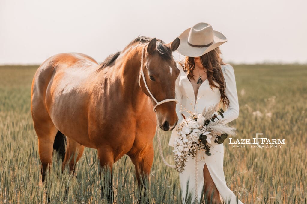 cowgirl bride with her horse and flowers
