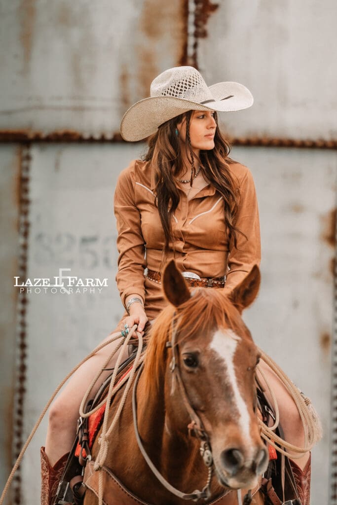 cowgirl sitting on her horse