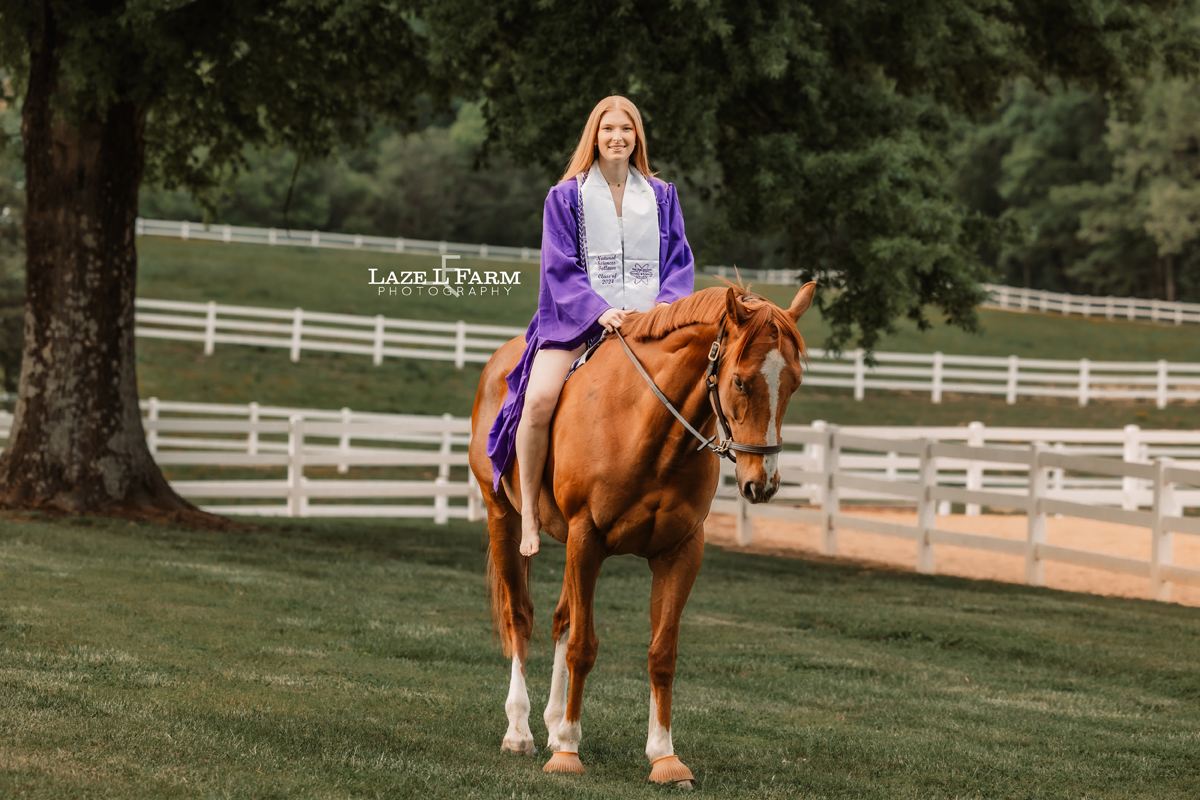 girl in cap and gown with her horse