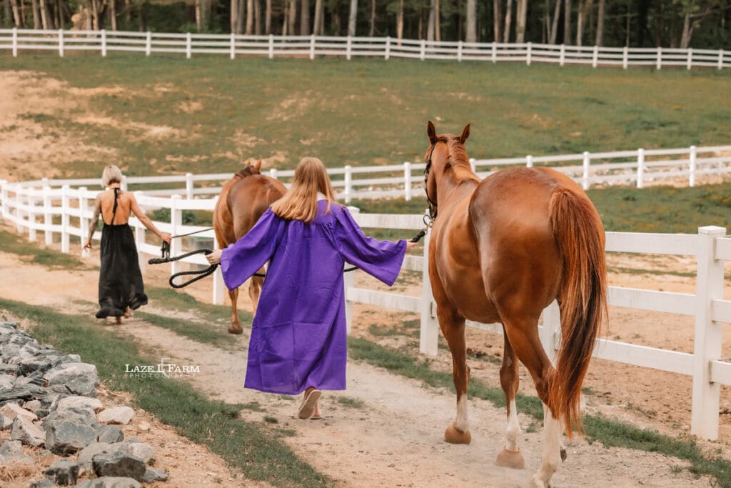 girl in cap and gown with her horse