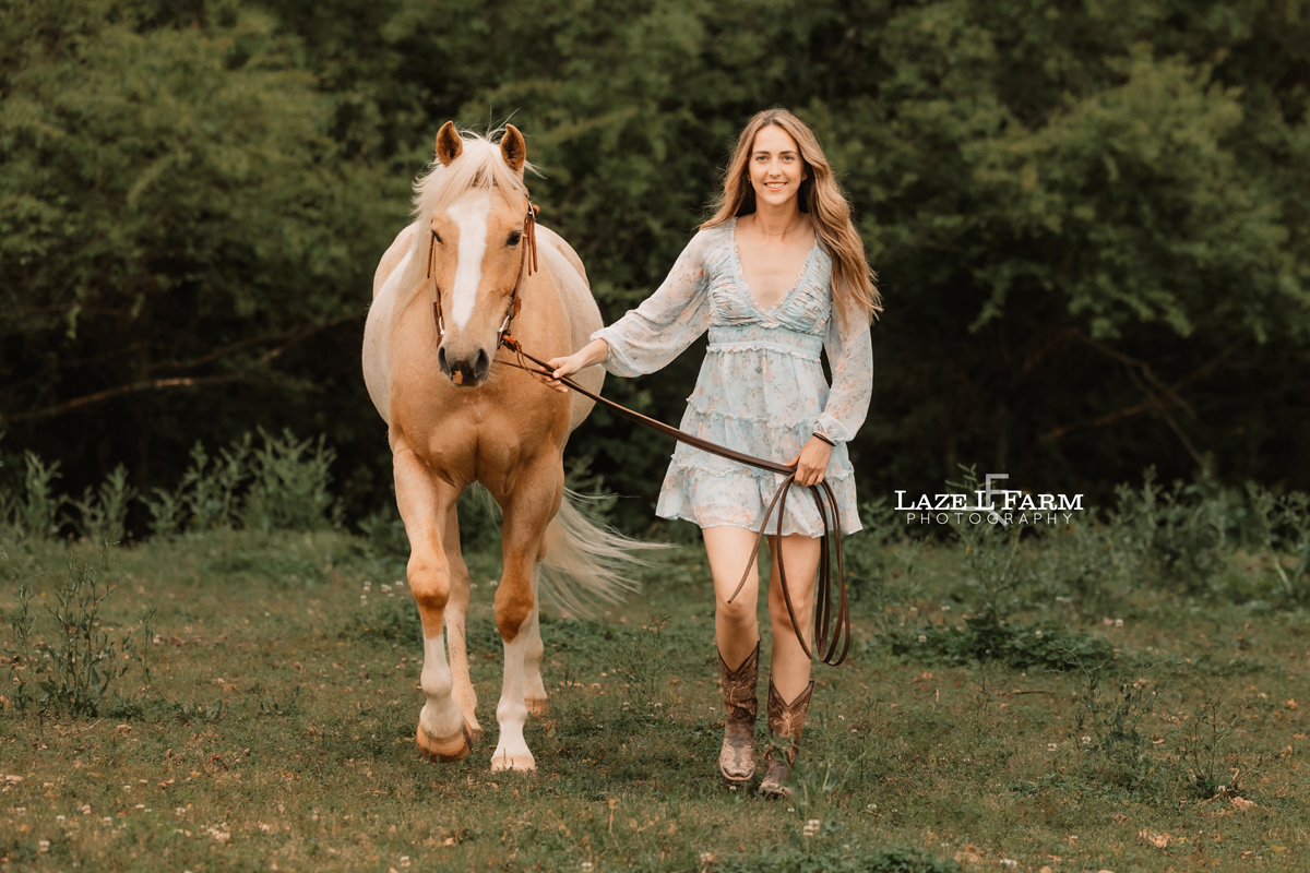 girl and her horse walking towards the camera