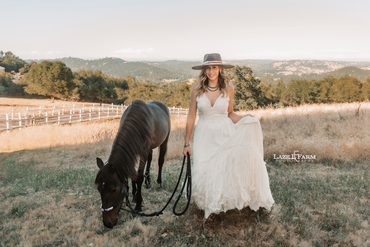 cowgirl with her horse walking towards the camera