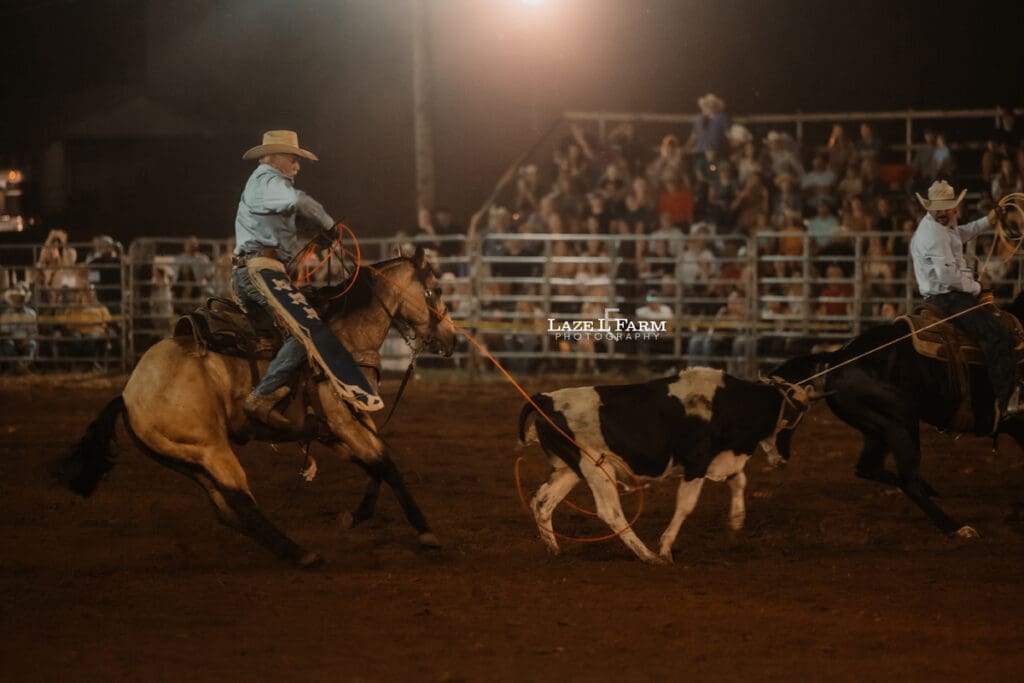 Team Roping at the Cleveland Rodeo while Laze L Farm Photography takes pictures