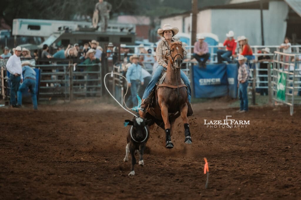 Cowgirl doing breakaway roping at the Cleveland Rodeo while Laze L Farm Photography takes pictures