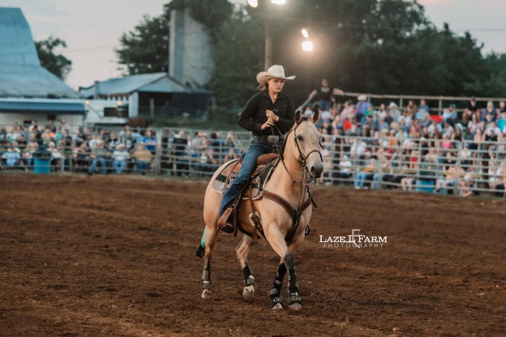 Cowgirl riding her horse at the Cleveland Rodeo while Laze L Farm Photography takes pictures