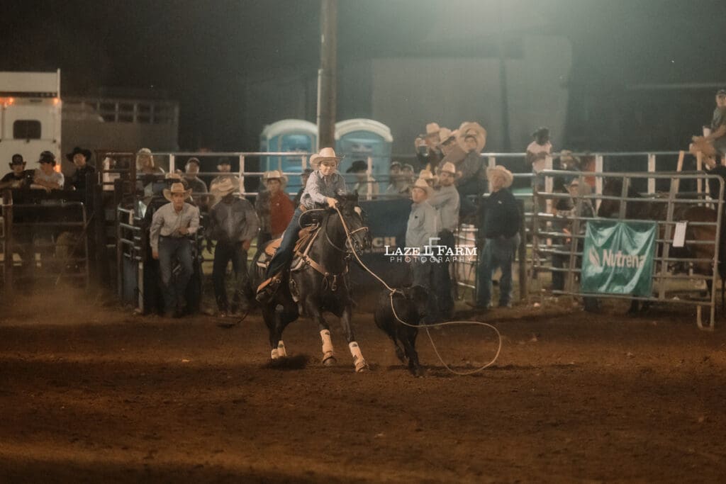 cowgirl doing breakaway roping at the Cleveland Rodeo with pictures by Laze L Farm Photography
