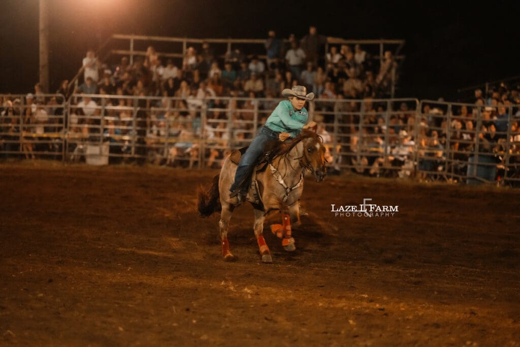 Cowgirls running barrels at the Cleveland Rodeo with pictures by Laze L Farm Photography
