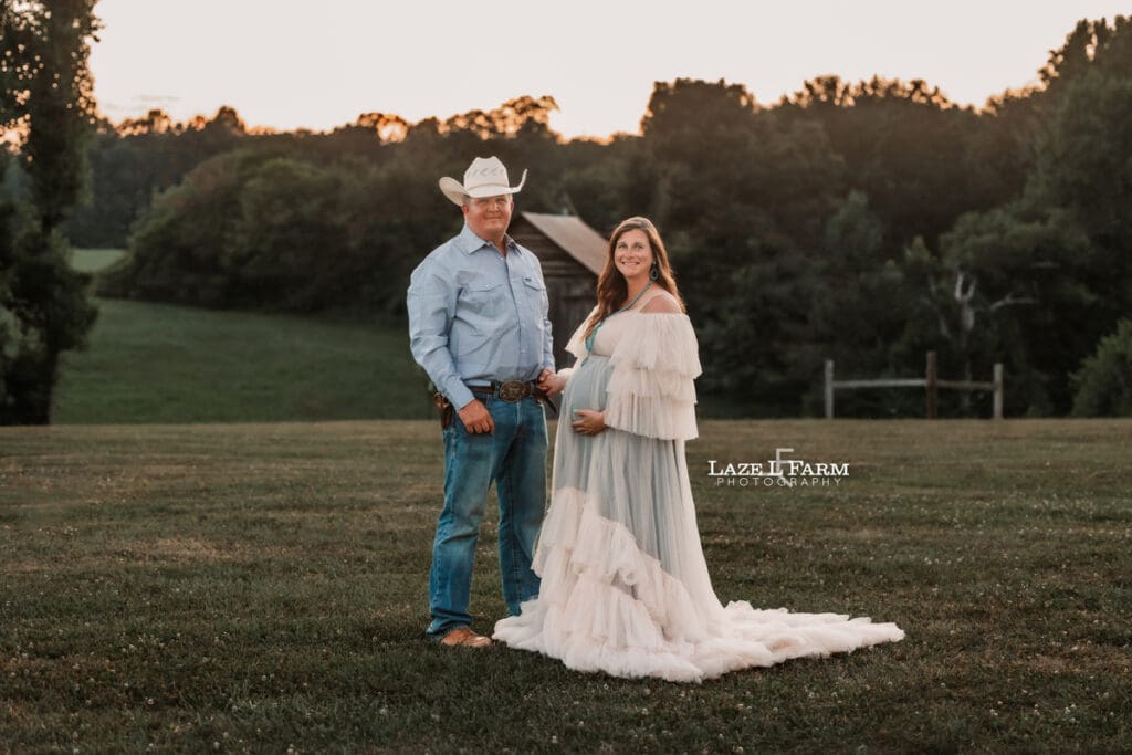 A girl and her husband during their maternity session with Laze L Farm Photography 