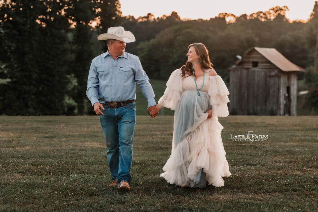 A girl and her husband during their maternity session with Laze L Farm Photography 