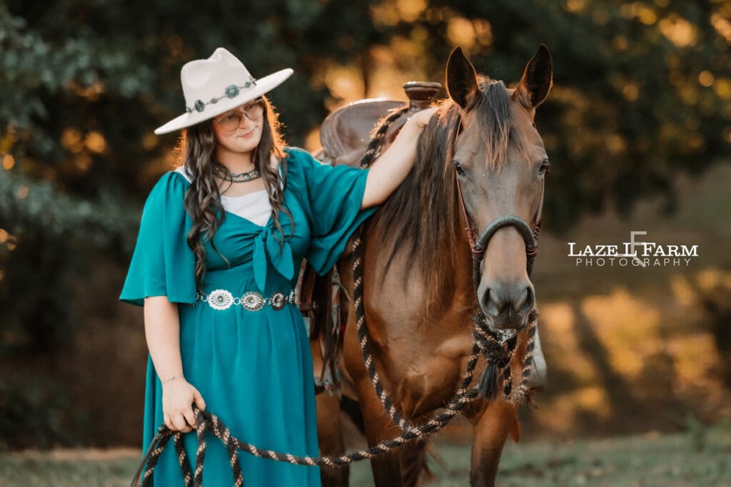 A cowgirl and her horse during an equine photoshoot with Laze L Farm Photography