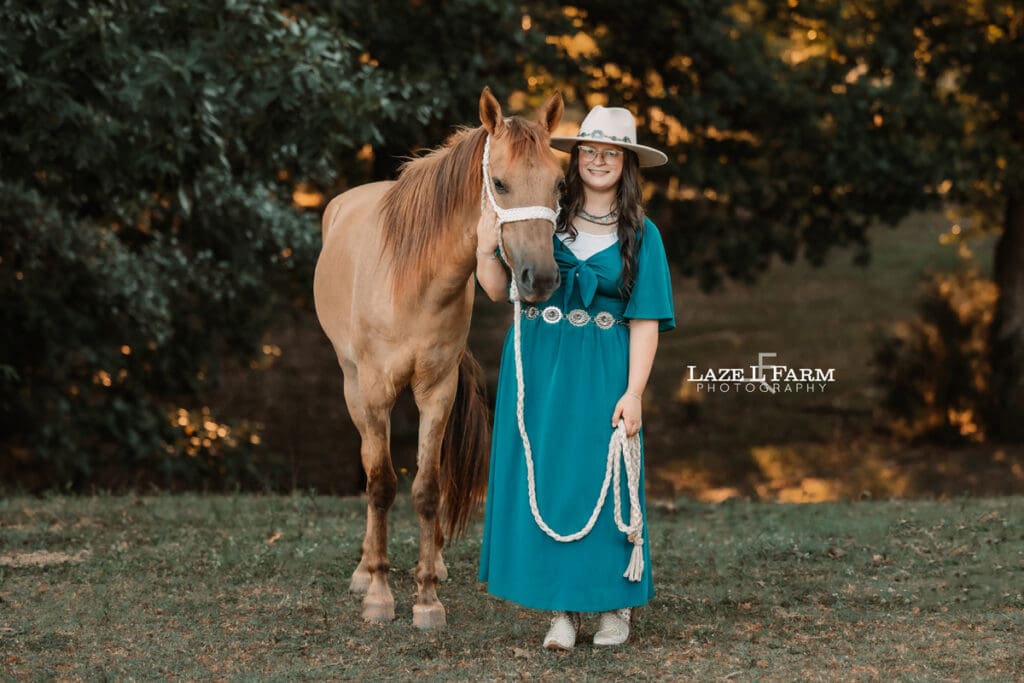 A cowgirl and her horse during an equine photoshoot with Laze L Farm Photography