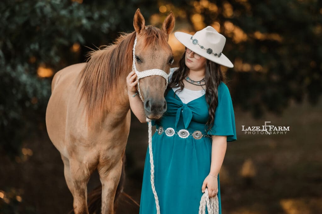 A cowgirl and her horse during an equine photoshoot with Laze L Farm Photography