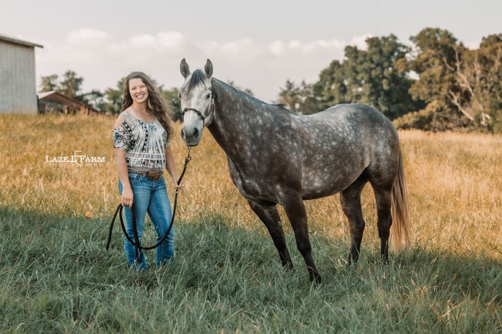 A girl with her horse in a field during a photoshoot with Laze L Farm Photography