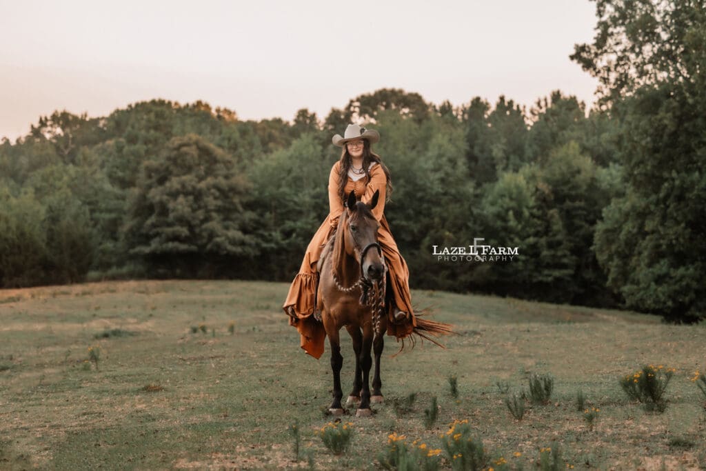 A cowgirl and her horse during an equine photoshoot with Laze L Farm Photography
