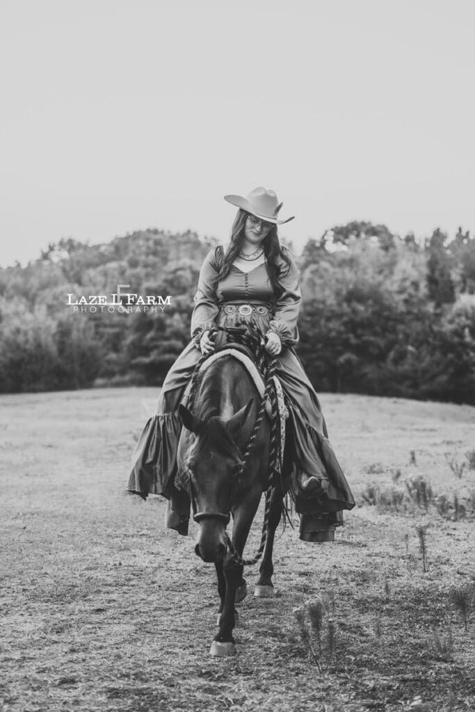 A cowgirl and her horse during an equine photoshoot with Laze L Farm Photography