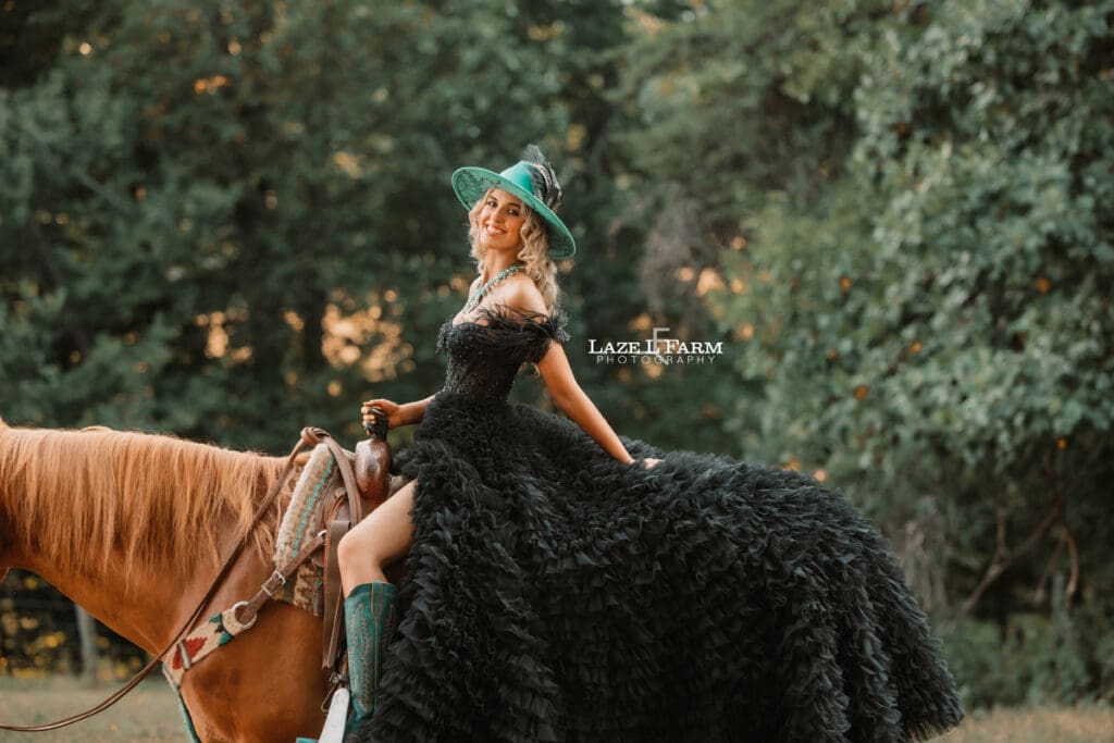 a girl in a black dress riding a horse at sunset  during a photoshoot with Laze L Farm Photography in Taylorsville NC