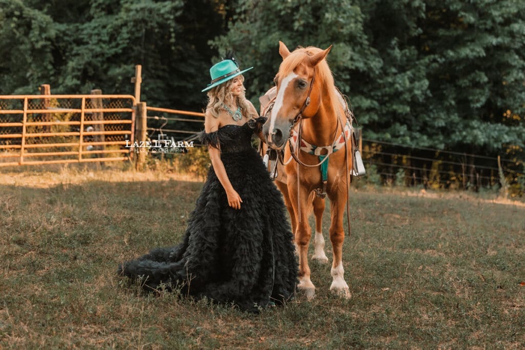 a girl in a black dress standing beside a horse during a photoshoot with Laze L Farm Photography in Taylorsville NC